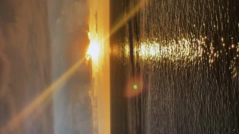 Vertical video. a fiery sunset on the seashore. storm clouds in the sea Stock Footage 276092628