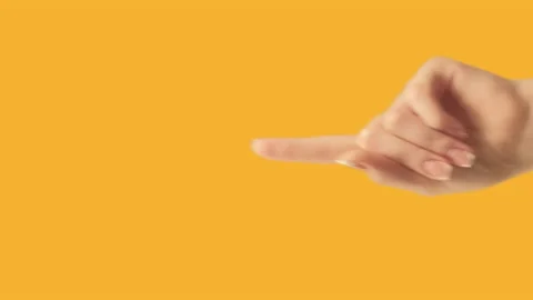 Vertical video finger pointing up hand on orange Stock Footage 234480911