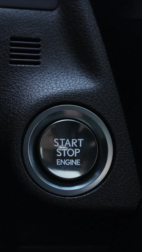 Vertical Video of Finger press the button to start the car engine. Driver's hand Stock Footage 306763961
