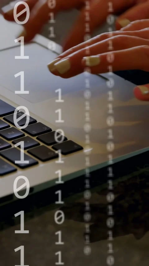 Vertical video: Fingers approaching keys then tapping, binary code rising and Stock Footage 334770730