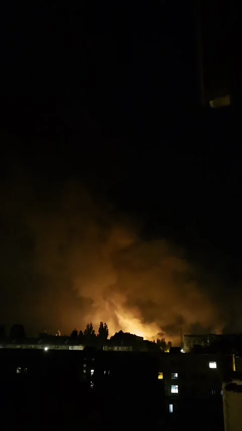 Vertical video of fire and smoke behind trees and buildings with drone soun.. Stock Footage 335135375