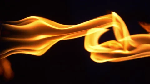 Vertical video of fire flames on the darkness in 4k slow motion 60fps Stock Footage 105332532
