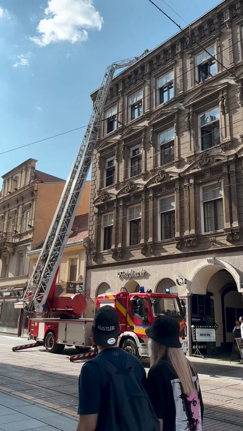 Vertical Video of Fire Truck Responding on Historic City Street Stock Footage 345163352