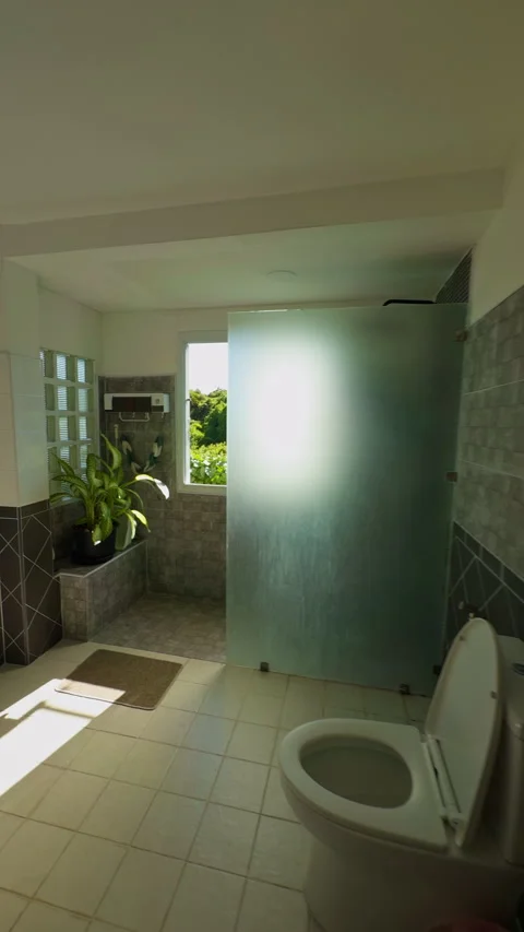 Vertical video. First Person View Walking From a Bedroom Into a Sunlit Bathroom, 스톡 동영상 338185483