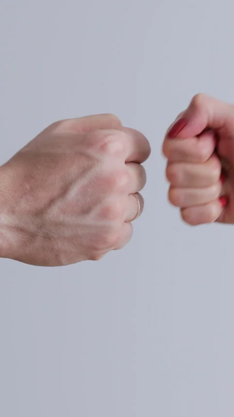 Vertical video. Fist to fist commit solidarity a respect gesture. Stock Footage 345703277