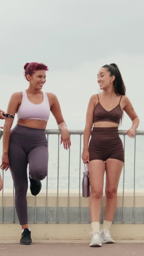 Vertical video, Fit Friends Chat After Beach Workout Stock Footage 312184594