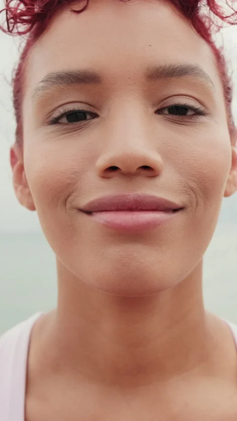 Vertical video, Fit Redhead Smiles On The Beach Stock Footage 303288399