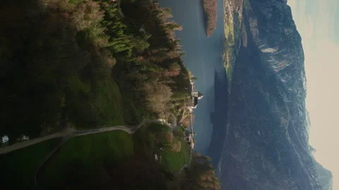 Vertical Video. Flight Over the Mountain Town on the Austrian Lake. Stock Footage 246124195