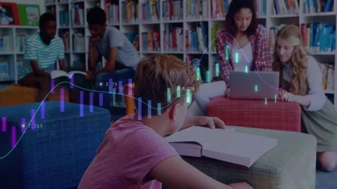Vertical video: Flipping textbook pink tee boy studying in school library while Stock Footage 330741005