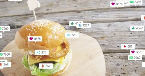 Vertical video: Floating badges moving from right over burger on wood board, Stock Footage 331429364