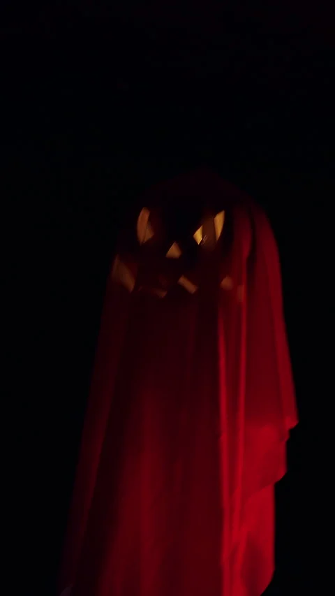 Vertical video. Floating Ghost Shaped Jack O Lantern Hovering in Dark Tunnel, Ha Stock Footage 337104192