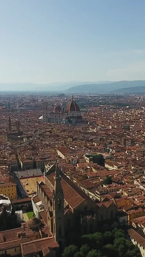 Vertical Video of Florence Cathedral and towers in historic city centre. Aerial Stock Footage 309280106