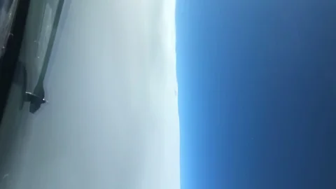Vertical video Flying above the clouds view from the cockpit aircraft. Stock Footage 100628384