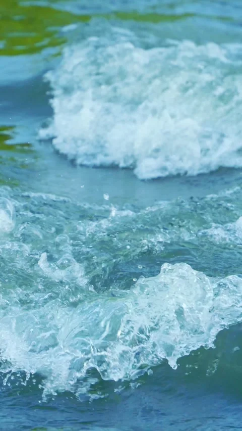 Vertical video of foamy blue river rapids Stock Footage 336318328
