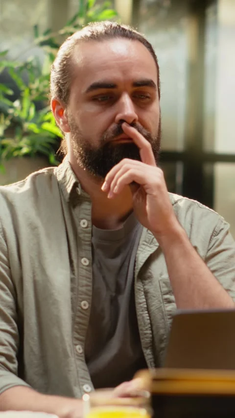 Vertical Video Focused pensive man, problem solving ideas, considering and Stock Footage 330439735