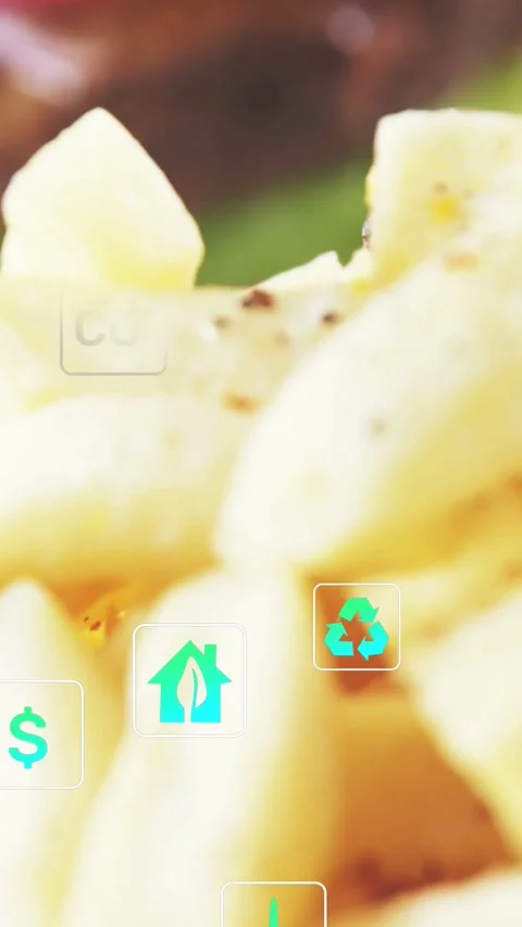 Vertical video: Food cam racking fries focusing teal icons popping around fries Stock Footage 334550505