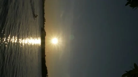 Vertical video footage, sunset reflection with silhouette of coal barge Stock Footage 141298627