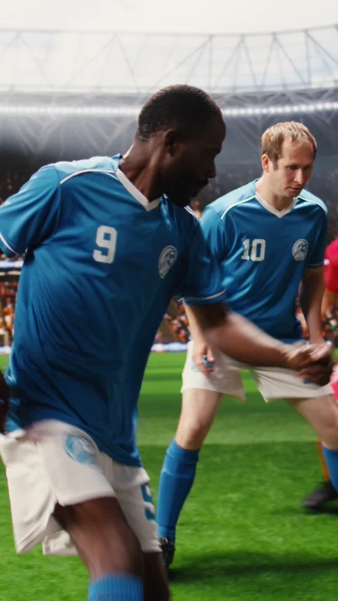 Vertical Video Football player accelerating with ball during dynamic attack on Stock Footage 338047054