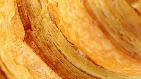 Vertical video format, fresh baked tasty crusty croissant circle rotation Video stock 246540911