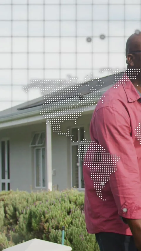 Vertical video: Frame widening showing porch man with map overlay, he leaning Stock Footage 334599130