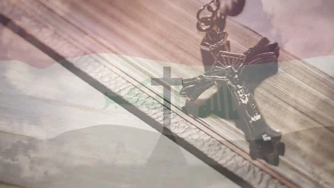 Vertical video: Frames starting crucifix resting on book, clouds drifting cross Video stock 331176122