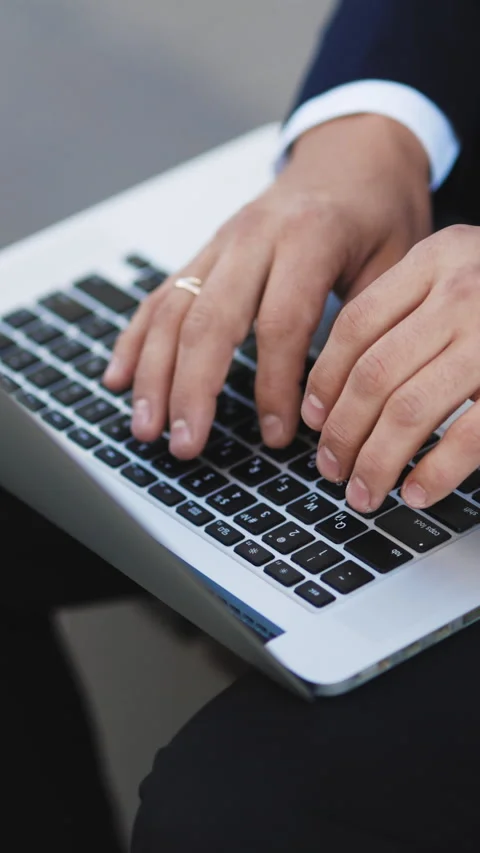 Vertical Video of Freelancer's hands typing on laptop keyboard. Businessman Stock Footage 302805190