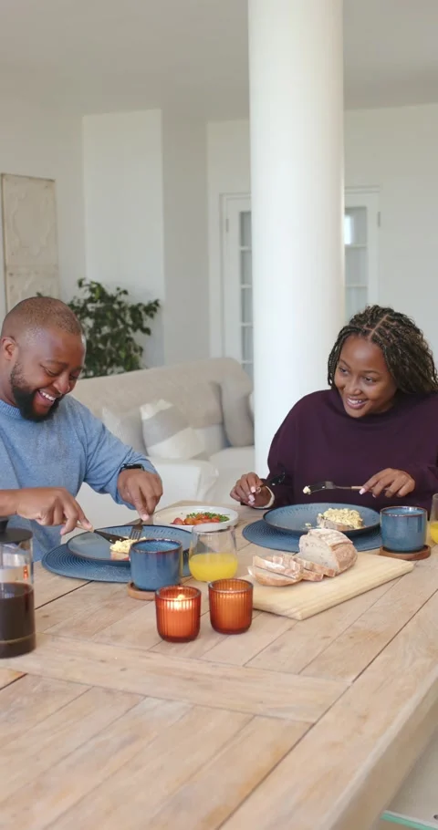 Vertical video: French press set African American couple sitting at home cutting Stock Footage 339499133