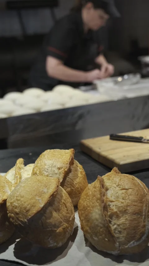 Vertical video, fresh bread in the bakery kitchen Stock Footage 247021251