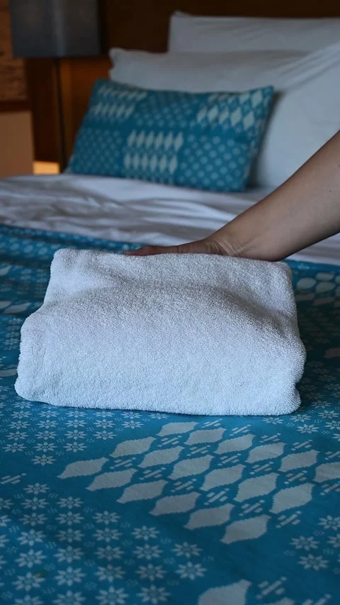 Vertical video of freshly washed and folded white towels are slowly and nea.. Stock Footage 318214926