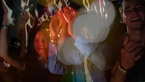 Vertical video: Front-row attendees clapping to live music, lens flare Stock Footage 334178739