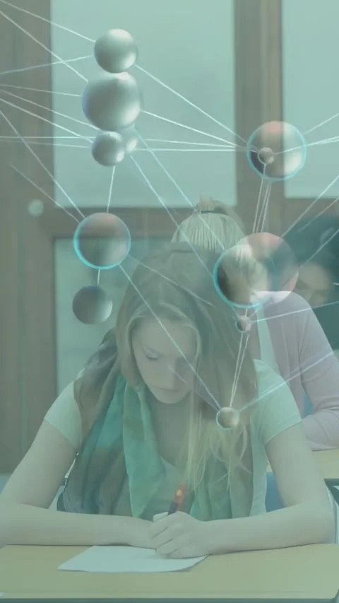 Vertical video: Front student writing red pen notes in class as AR nodes Stock Footage 334605063