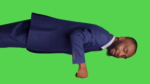 Vertical video: Front view of corporate manager in suit asking someone to come Stock Footage 237347190