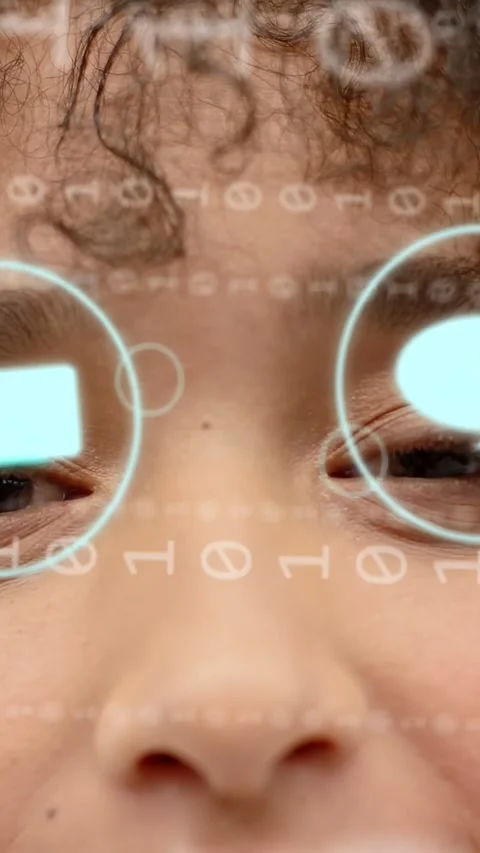 Vertical video: Frontcam starting AR tech while woman opening eyes, binary icons Stock Footage 333953141