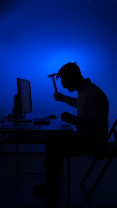Vertical video Frustrated man feeling rage, smashing computer with hammer Stock Footage 318980633