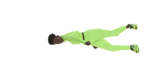 Vertical video. Full length shot of African woman in tracksuit dancing hip-hop. Stock Footage 141933973