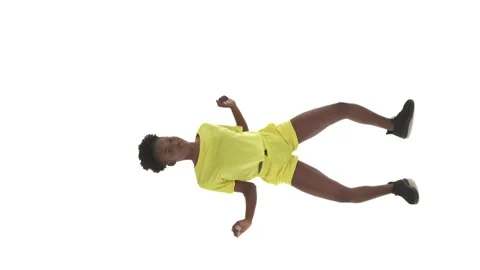 Vertical video. Full length shot of African woman dancing on white background. Stock Footage 141935187