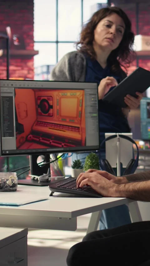 Vertical Video Game developer utilizes AI generated program to design spaceship Stock Footage 308493047