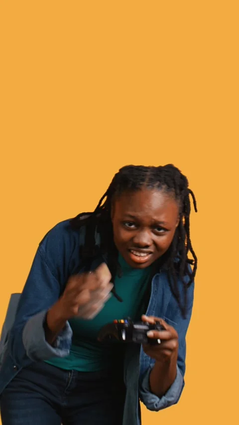 Vertical video Gamer holds controller, focused on finishing videogame level Stock Footage 274233926