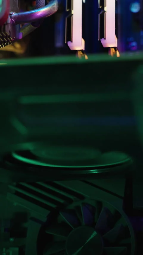 Vertical video. Gaming PC with lighting, cooler on the graphics card rotating, v Stock Footage 266212237