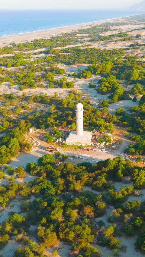 Vertical video. Gelemis, Turkey. Ancient lighthouse at Patara with Mediterranean 스톡 동영상 321720596