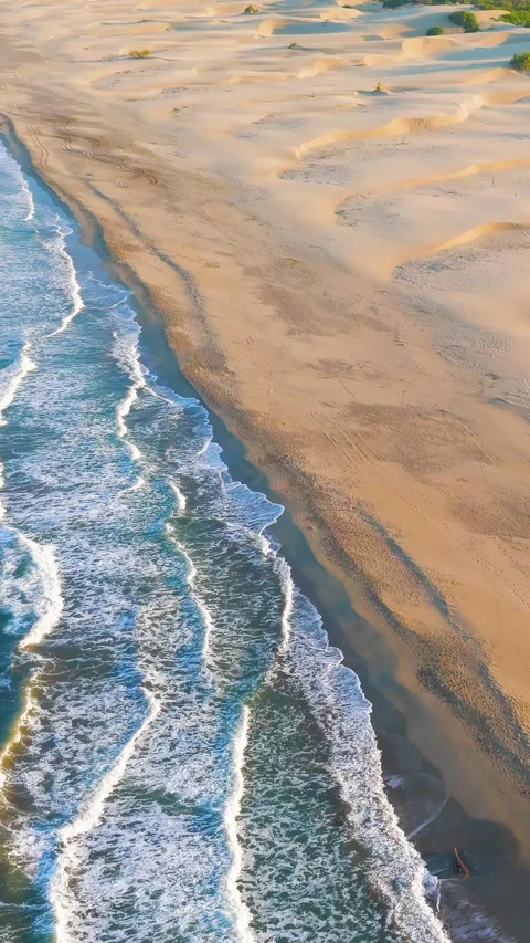 Vertical video. Gelemis, Turkey. Close aerial view of white foam waves on Patara Video stock 320154201