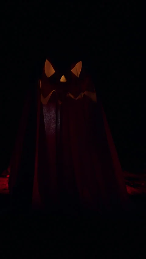 Vertical video. Ghost Shaped Jack O Lantern Decoration Inside Dark Tunnel With C Stock Footage 337106383