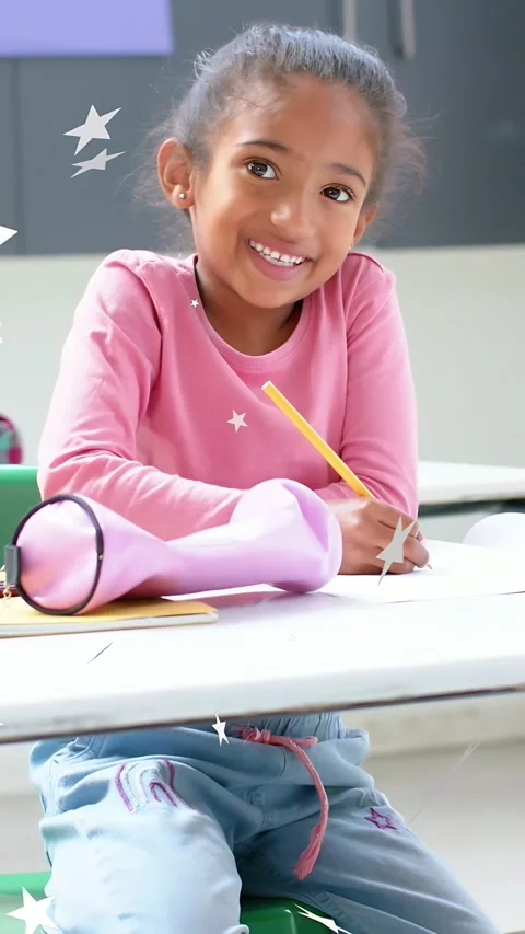 Vertical video: Girl student responding to prompt in school, writing with pencil Stock Footage 333745167