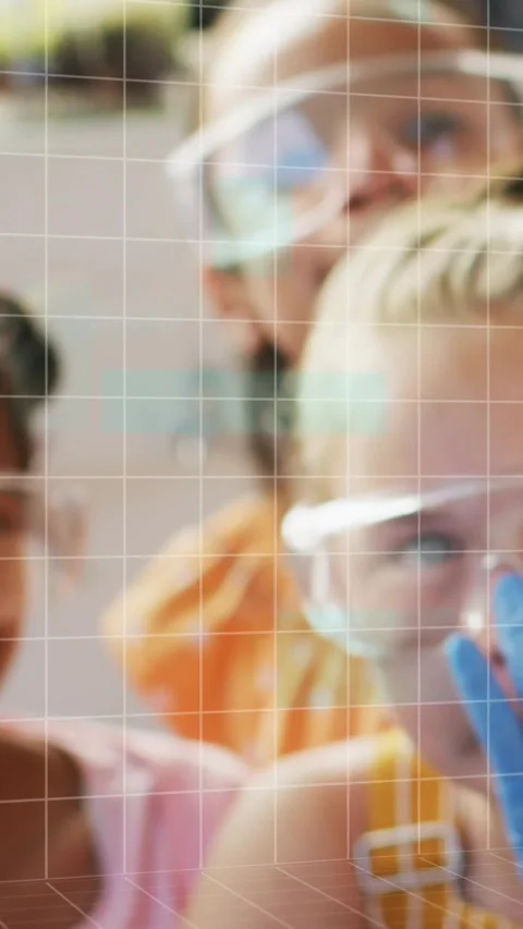 Vertical video: Girl using pipette releasing drop, grid pixelating while peers Stock Footage 331215570