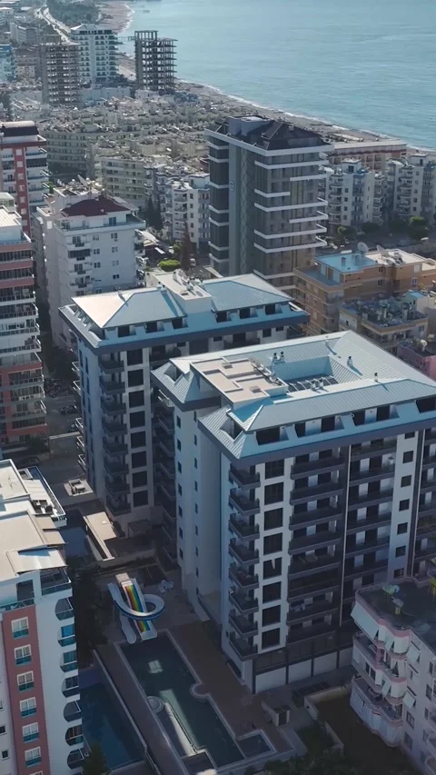 Vertical Video: Glass-fronted premium properties on the Mediterranean coast Stock Footage 297632280
