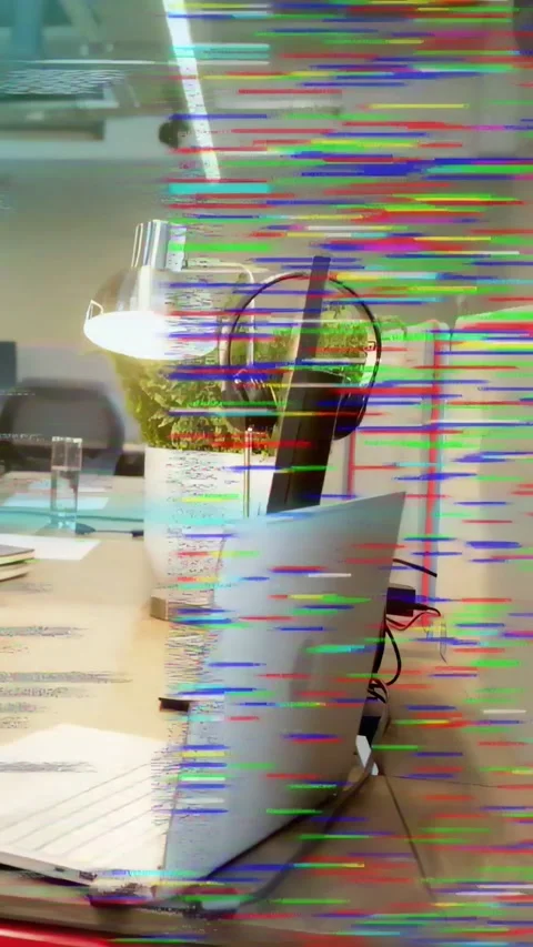 Vertical video: Glitch starting laptop and stand shifting as HUD and code Stock Footage 334694941