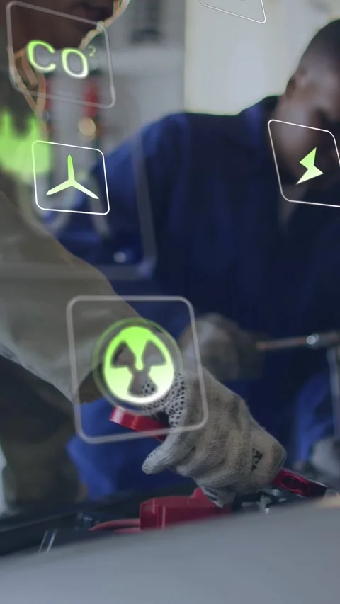 Vertical video: Gloved auto tech grasping red clamp, securing battery for test, Stock Footage 335355337