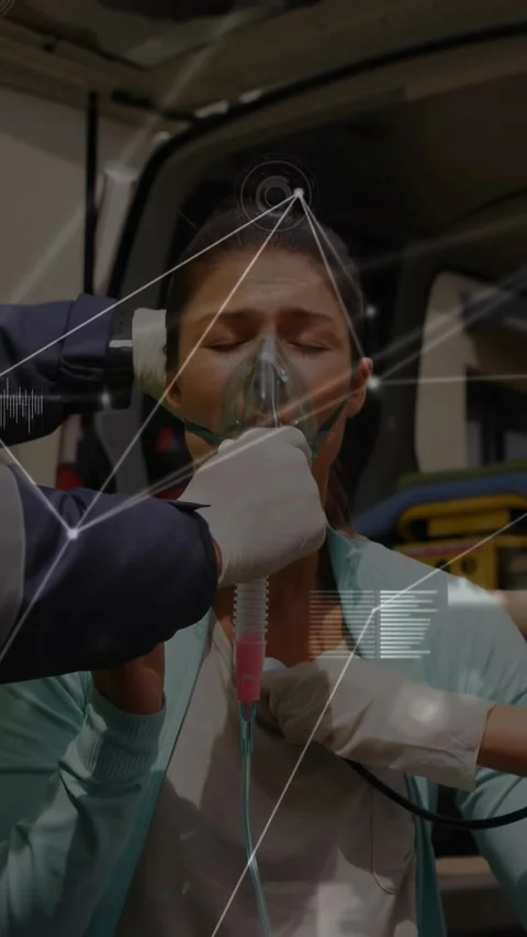 Vertical video: Gloved medic placing oxygen mask while EMS steadying breathing Stock Footage 330964738