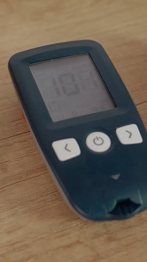 Vertical video Glucometer reading of 101 mg dL shows blood sugar level near Stock Footage 346714074