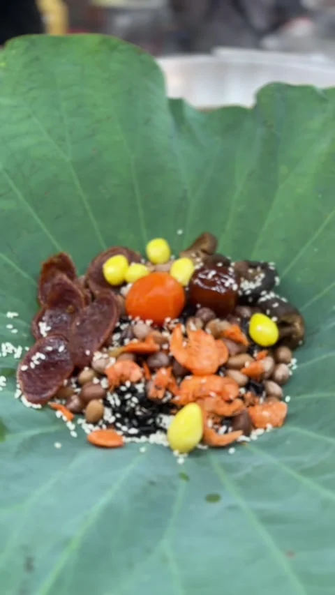 Vertical video of Glutinous rice dumpling served on lotus leaf Stock Footage 314098463